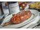 A savory grilled steak sits on a white plate, featuring dark brown sear marks at 3653 E Highland Ave, Phoenix, AZ 85018