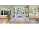 Bright and airy entry featuring a welcoming front porch view, framed by sidelight windows and beautiful wood flooring at 3653 E Highland Ave, Phoenix, AZ 85018