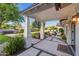 Inviting front porch with a seating area and landscaped front yard creating an inviting entry at 3653 E Highland Ave, Phoenix, AZ 85018