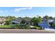 Beautiful one-story home showcasing its manicured lawn, mature trees, and covered parking area at 3653 E Highland Ave, Phoenix, AZ 85018