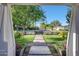 An inviting walkway leads to the front door, framed by lush greenery and a well-manicured lawn at 3653 E Highland Ave, Phoenix, AZ 85018