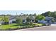 Charming one-story home featuring a manicured front lawn, mature trees, and a covered garage at 3653 E Highland Ave, Phoenix, AZ 85018