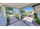 A well-maintained front yard featuring lush green grass, mature trees, and a charming seating area with a fire pit at 3653 E Highland Ave, Phoenix, AZ 85018