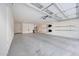 Well-lit, roomy garage with water heater, storage for sporting equipment, and epoxy floors, blending functionality and style at 3653 E Highland Ave, Phoenix, AZ 85018