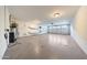 Spacious garage with epoxy floors, water heater and paddleboards for storage, offering ample space for vehicles and hobbies at 3653 E Highland Ave, Phoenix, AZ 85018