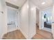 Bright hallway that connects the rooms, with hardwood and carpet floors, creating a seamless flow throughout the home at 3653 E Highland Ave, Phoenix, AZ 85018