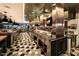 Commercial kitchen space featuring stainless steel appliances, countertops, and tile flooring at 3653 E Highland Ave, Phoenix, AZ 85018