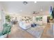 Bright and airy living space featuring an open layout, hardwood floors, and comfortable seating arrangements at 3653 E Highland Ave, Phoenix, AZ 85018