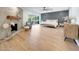 Stylish bedroom with wood flooring, modern fireplace, decorative wood wall, and access to the backyard at 3653 E Highland Ave, Phoenix, AZ 85018