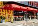 Charming outdoor seating area with vibrant umbrellas and neatly arranged tables, ideal for a casual dining experience at 3653 E Highland Ave, Phoenix, AZ 85018