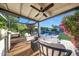 Charming covered patio with comfortable seating and a view of the backyard pool and landscaping at 3653 E Highland Ave, Phoenix, AZ 85018