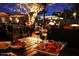 Cozy outdoor patio scene with people dining and a warmly lit ambiance at 3653 E Highland Ave, Phoenix, AZ 85018
