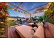 Luxurious outdoor space featuring a pool, lounge area, and landscaped backyard at 3653 E Highland Ave, Phoenix, AZ 85018