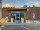 Inviting restaurant facade with brick accents, potted plants, and a curbside pickup sign at 3653 E Highland Ave, Phoenix, AZ 85018