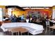 Comfortable seating arrangement in a stylish restaurant interior with a wine rack and vibrant decor at 3653 E Highland Ave, Phoenix, AZ 85018