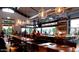Spacious restaurant interior with ample seating, a full bar, and stylish pendant lighting at 3653 E Highland Ave, Phoenix, AZ 85018