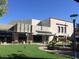 Exterior of retail shops with lush landscaping and decorative water fountains at 3653 E Highland Ave, Phoenix, AZ 85018