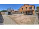 Spacious backyard featuring a storage shed, gravel landscaping, and potential for customization at 40437 W Robbins Dr, Maricopa, AZ 85138