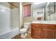 Neutral bathroom featuring a tub, toilet, and wood vanity with mirror at 40437 W Robbins Dr, Maricopa, AZ 85138