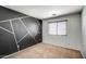 Bedroom features a painted wall with an abstract geometric pattern at 40437 W Robbins Dr, Maricopa, AZ 85138