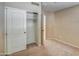 Clean bedroom with neutral carpet and a sliding-door closet at 40437 W Robbins Dr, Maricopa, AZ 85138