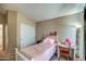 Inviting bedroom with a bed, window, curtains, and a writing desk at 40437 W Robbins Dr, Maricopa, AZ 85138