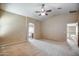 The large bedroom boasts a vaulted ceiling and easy access to the bathroom at 40437 W Robbins Dr, Maricopa, AZ 85138