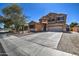 Charming two-story home with a manicured lawn and a spacious two car driveway at 40437 W Robbins Dr, Maricopa, AZ 85138