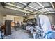 Cluttered two-car garage with household items, storage, and organization needed at 40437 W Robbins Dr, Maricopa, AZ 85138