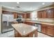 Kitchen featuring stainless steel appliances, ample cabinet space, and tile flooring at 40437 W Robbins Dr, Maricopa, AZ 85138