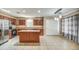 Open-concept kitchen with stainless appliances, a center island, and ample cabinet space at 40437 W Robbins Dr, Maricopa, AZ 85138