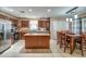 A well appointed kitchen with an island, stainless steel appliances, and breakfast nook at 40437 W Robbins Dr, Maricopa, AZ 85138