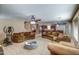 Expansive living room with comfortable seating, open floor plan, carpet floors, and a cozy atmosphere for gatherings at 40437 W Robbins Dr, Maricopa, AZ 85138