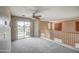 Upstairs loft boasting a ceiling fan, access to a balcony, and a railing overlooking downstairs at 40437 W Robbins Dr, Maricopa, AZ 85138