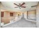 The loft offers a relaxing space with a ceiling fan, balcony access, and overlooks the lower level at 40437 W Robbins Dr, Maricopa, AZ 85138