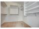 Walk-in closet with built-in shelving and ample space for storage at 40437 W Robbins Dr, Maricopa, AZ 85138