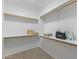 Walk-in closet featuring multiple shelves, hanging rods, and carpeting at 4222 E Torrey Pines Ln, Chandler, AZ 85249