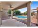 A covered patio overlooks a well-maintained backyard with an in-ground pool at 4222 E Torrey Pines Ln, Chandler, AZ 85249