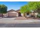 Charming single-story home featuring a two-car garage and desert landscaping at 4222 E Torrey Pines Ln, Chandler, AZ 85249
