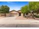 Charming single-story home featuring a well-maintained front yard and a two-car garage at 4222 E Torrey Pines Ln, Chandler, AZ 85249