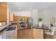 Spacious kitchen with stainless steel appliances, granite countertops, and a central island with barstool seating at 4222 E Torrey Pines Ln, Chandler, AZ 85249