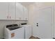 Functional laundry room equipped with modern washer, dryer, and ample storage space at 4222 E Torrey Pines Ln, Chandler, AZ 85249