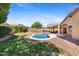 Beautiful home featuring an in-ground pool, well-maintained lawn, mature trees, and gravel landscaping at 4222 E Torrey Pines Ln, Chandler, AZ 85249