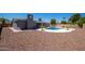 Expansive backyard featuring a private pool, desert landscaping, and gray exterior of the home at 4506 W Golden Ln, Glendale, AZ 85302