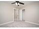 This bedroom features sliding closet doors for plenty of storage and a ceiling fan for comfort at 4506 W Golden Ln, Glendale, AZ 85302