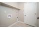 This laundry room is ready for your washer and dryer and has a shelf for plenty of storage at 4506 W Golden Ln, Glendale, AZ 85302