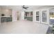 Open-concept space with tile flooring, mini bar, fireplace, and seamless transition to kitchen area at 4506 W Golden Ln, Glendale, AZ 85302