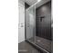 The bathroom features a stand-up shower with black textured tiling at 4506 W Golden Ln, Glendale, AZ 85302