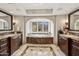 The expansive bathroom is adorned with marble surfaces and features a large soaking tub at 4949 E Lincoln Dr # 11, Paradise Valley, AZ 85253
