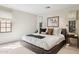 This bedroom features a comfy bed, neutral walls, and windows which provide soft natural light at 4949 E Lincoln Dr # 11, Paradise Valley, AZ 85253
